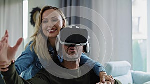 Couple using virtual reality simulator 