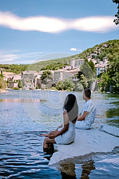 Couple on vacation in Ardeche France, view of the village of Vogue in Ardeche. France