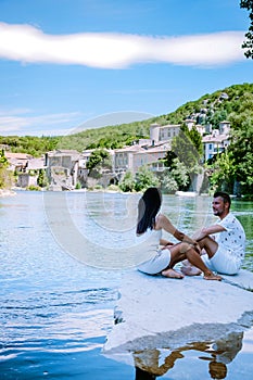 Couple on vacation in Ardeche France, view of the village of Vogue in Ardeche. France photo