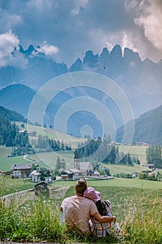 Couple on vacation in the Dolomites Italy, Santa Magdalena Village in Dolomites area Italy Val di Funes