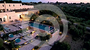 Couple on vacation at luxury resort in Sicily during sunset by the infinity pool in Sicilia Italy