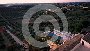 couple on vacation at luxury resort in Sicily during sunset by the infinity pool in Sicilia Italy