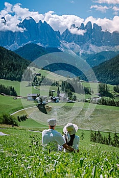 Couple on vacation Santa Magdalena Village in Dolomites area Italy, couple on vacation Val Di Funes Italian Dolomites