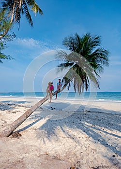 couple on vacation in Thailand, Chumpon province , white tropical beach with palm trees, Wua Laen beach Chumphon area