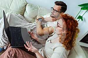 Couple after vaccination having medical teleconsultation using laptop at home photo