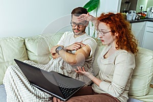 Couple after vaccination having medical teleconsultation using laptop at home photo