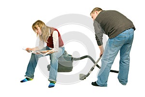 Couple With Vacuum-Cleaner