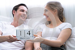 Couple on Valentine`s Day, Romantic couples sitting on the bed in the bedroom