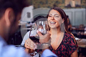 Couple On Valentines Day First Date Making A Toast In Restaurant