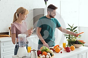 couple of vegans using tablet with recipe for preparing food