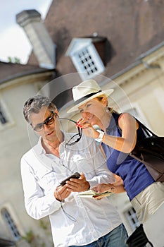 Couple visiting a castle in the Bordeaux vineyard