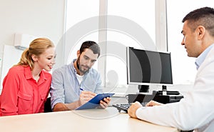 Couple visiting doctor at family planning clinic