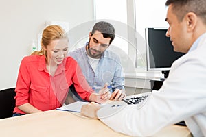 Couple visiting doctor at family planning clinic