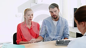 Couple visiting doctor at family planning clinic