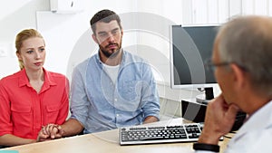 Couple visiting doctor at family planning clinic