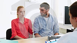 Couple visiting doctor at family planning clinic