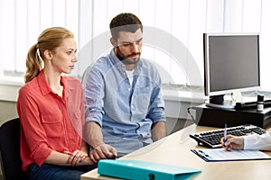 Couple visiting doctor at family planning clinic