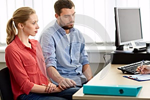 Couple visiting doctor at family planning clinic