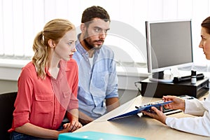 Couple visiting doctor at family planning clinic