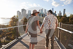 Couple Visiting New York With Manhattan Skyline In Background