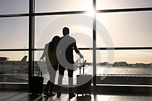 Couple waiting for flight in airport