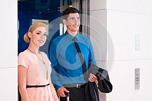 Couple waiting for hotel elevator