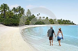 Couple Walk on One foot Island in Aitutaki Lagoon Cook Islands