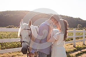 Couple walk at the ranch during summer day