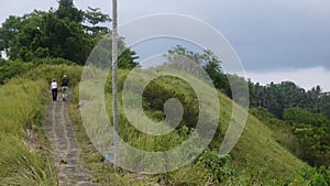 Couple walking along the trail in the tropics