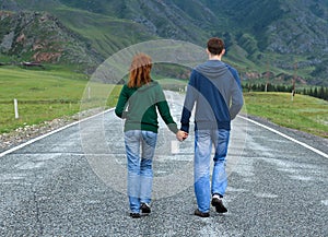 Couple walking Altai road