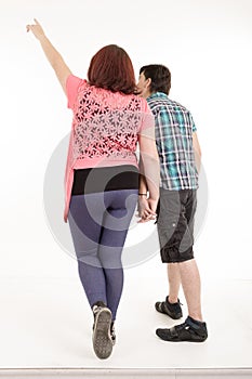 Couple walking away in estudio photo