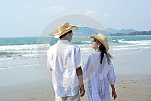 Couple Walking on Beach