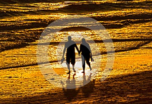 Couple walking on beach