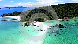 couple walking at the beach of Koh Kham Trat Thailand, aerial view of tropical island near Koh Mak