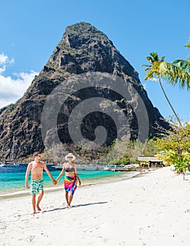 couple walking on the beach summer vacation sunny day tropical Island of Saint Lucia Caribbean