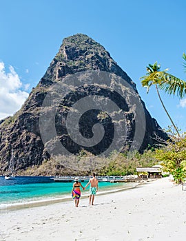 couple walking on the beach summer vacation sunny day tropical Island of Saint Lucia Caribbean