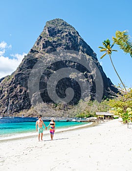 couple walking on the beach summer vacation sunny day tropical Island of Saint Lucia Caribbean