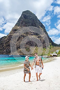 couple walking on the beach summer vacation sunny day tropical Island of Saint Lucia Caribbean