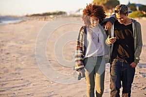 Couple, walking and conversation together on beach, sunset with gen z people on nature date in summer. Love, affection