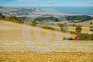 couple walking in the country lanes with the famous Cap Gris Nez on the horizon