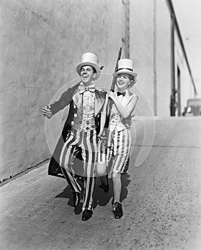 Couple walking down a street in a patriotic outfit