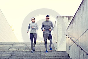 Couple walking downstairs on stadium photo