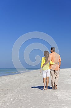 Couple Walking on An Empty Beach