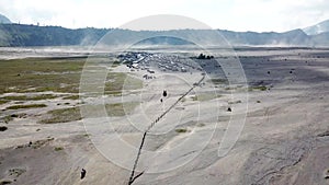 Couple walking at Mt.Bromo, Java island, Indonesia