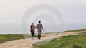 A couple walking outdoor
