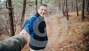 Couple walking in the pine forest