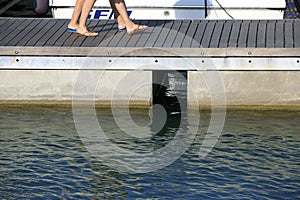 Couple walking on the port pier