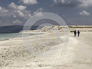 Couple walking on a sandy beach