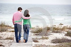 Couple walking by the sea