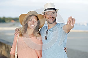 couple walking by seaside